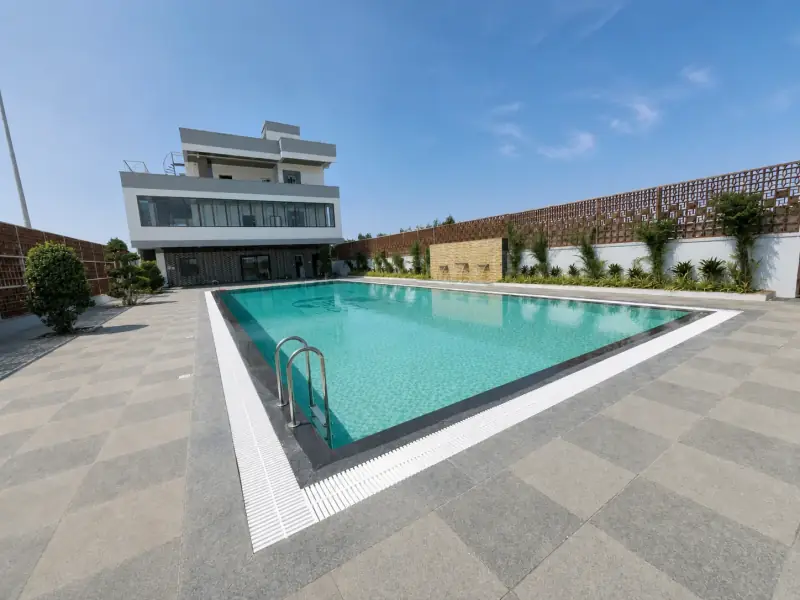 Elite Health Club swimming pool filled with clear water in natural daylight