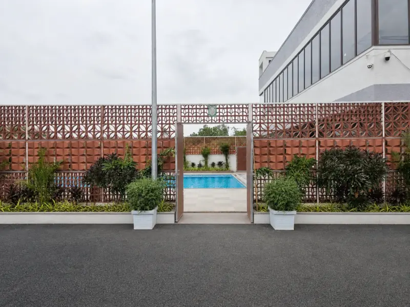 Clean landscaped entrance to the Elite Health Club pool area